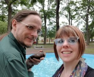 K, Tam, with ferret Patrick